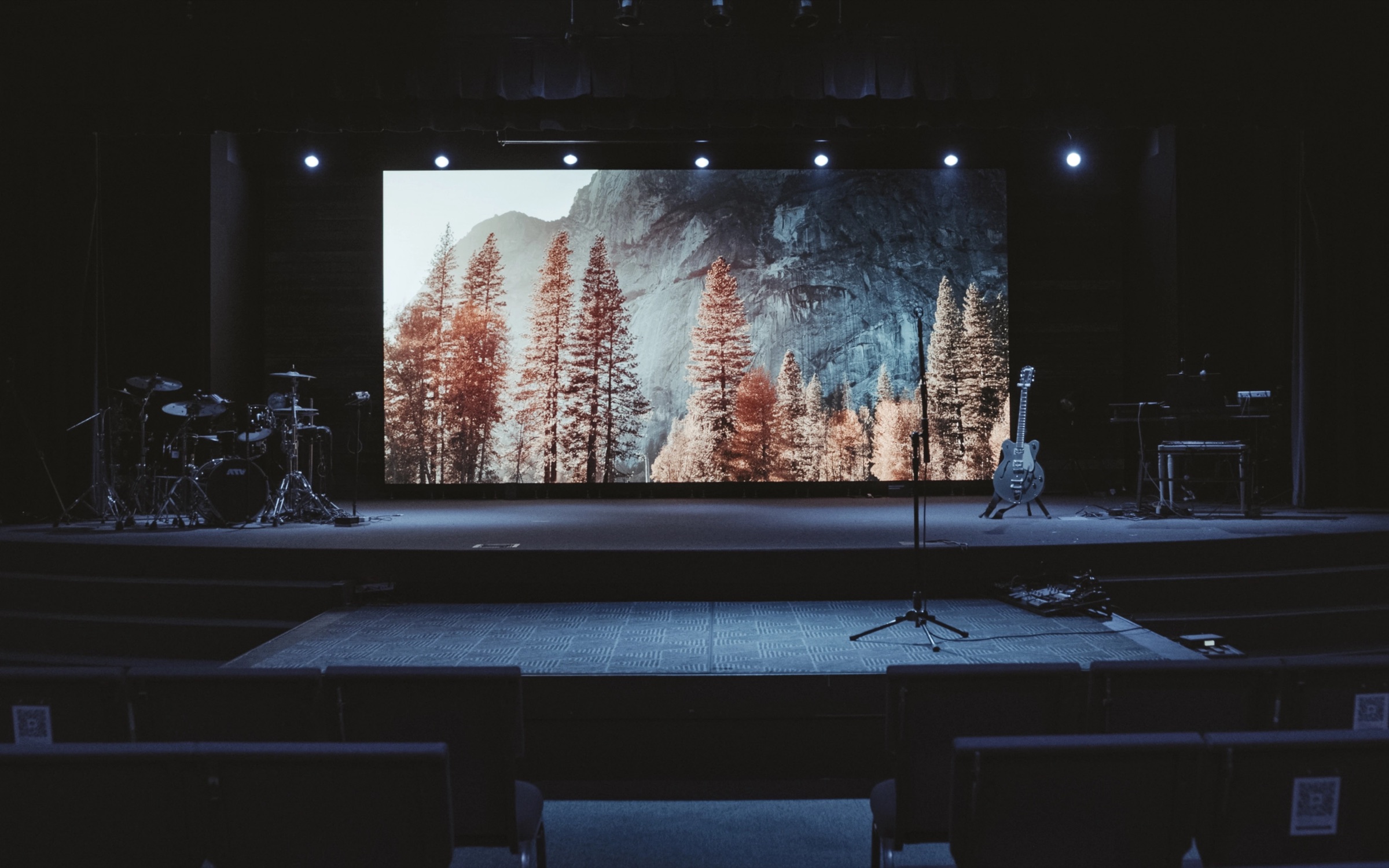 South Fellowship Church auditorium in Littleton, CO with a wide Altitude APEX LED wall showing a forest scene