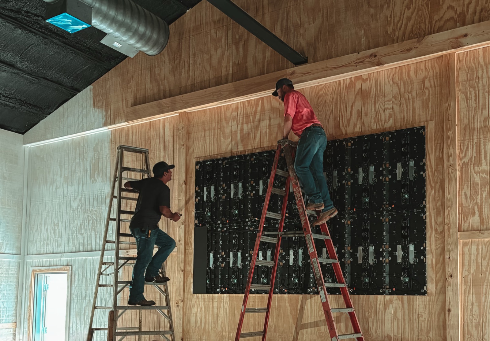 Technician installing an Altitude LED wall
