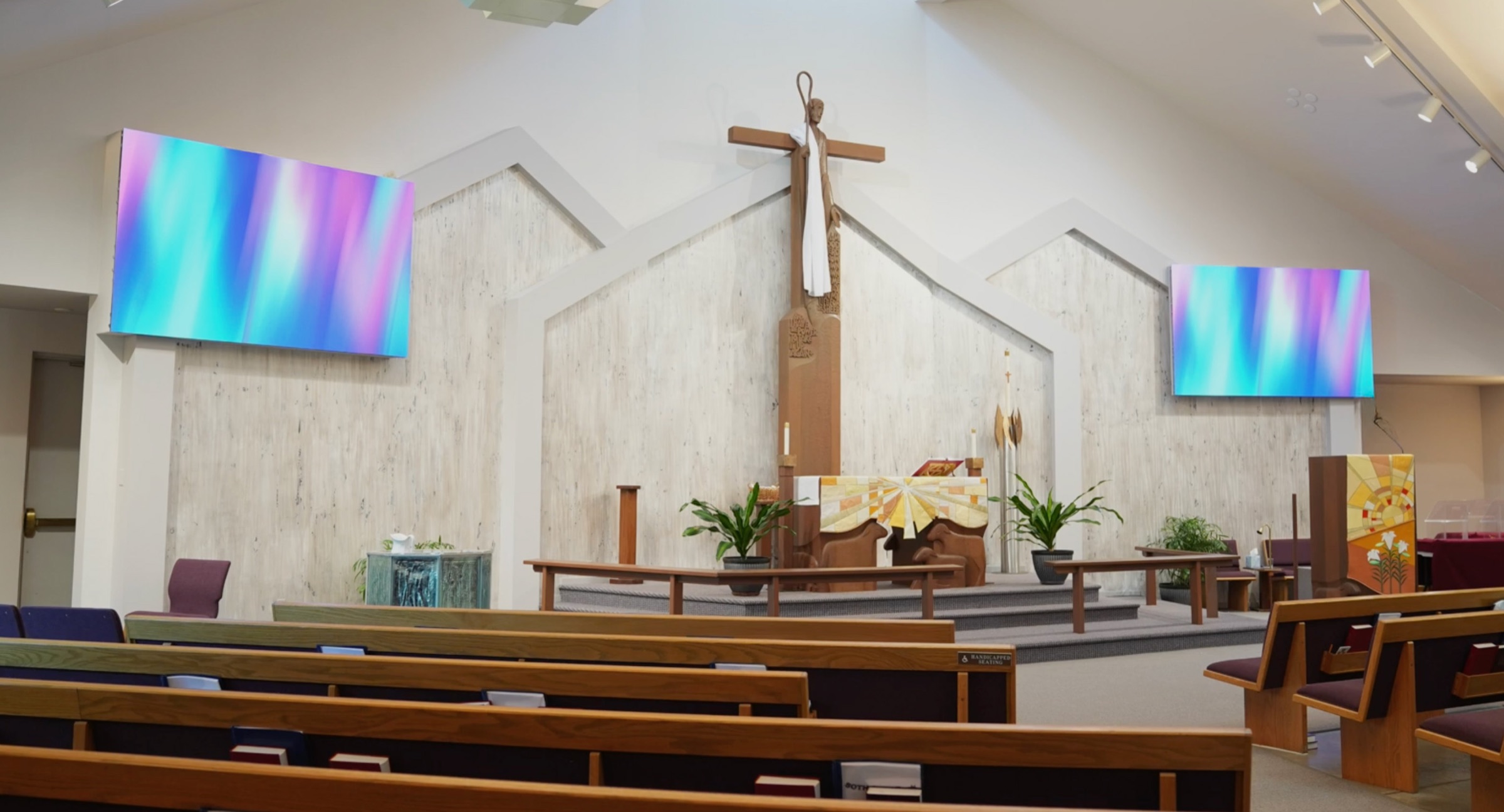 Shepherd of the Hills sanctuary in Fort Collins, CO with the center cross and Altitude LED screens